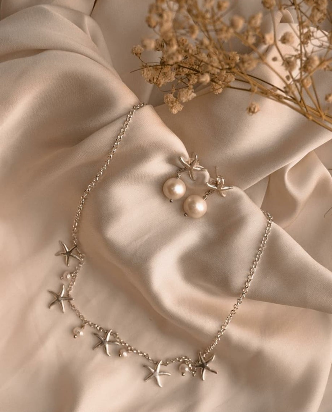 Collana con stelle marine e perle